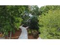 An aerial view showcasing a landscaped home nestled among mature trees offering an intimate setting and privacy at 608 Wingspread, Peachtree City, GA 30269