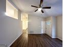 Bright living room with wood floors, neutral paint, and entry door with sidelights at 3865 Lehigh Blvd, Decatur, GA 30034
