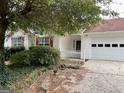 Single story home with mature landscaping and two car garage at 3041 Regal Dr, Mcdonough, GA 30253