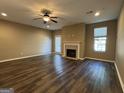 Bright living room featuring a fireplace, ceiling fan, recessed lighting, and a sliding glass door at 1853 Broad River Rd, Atlanta, GA 30349