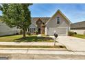 Inviting two-story home with a well-manicured lawn and attached two-car garage at 4893 River Overlook Way, Lithonia, GA 30038