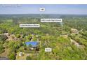 Aerial view showing the home with proximity to Little Mulberry River and Mill Creek High School at 1326 Harmony Grove Church Rd, Auburn, GA 30011