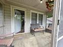 Inviting porch with seating, views of the neighborhood, and a 'Welcome' mat at the front door at 502 S Evelyn Nw Pl, Atlanta, GA 30318