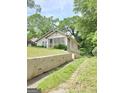 Exterior view showcasing the landscaping and pathway, creating an appealing setting at 502 S Evelyn Nw Pl, Atlanta, GA 30318