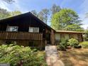 Charming home with front entry flanked by stone and dark wooden exterior accents at 100 Gran De Ct, South Fulton, GA 30349
