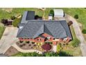 Birds-eye view of brick house, landscaped yard, circular driveway, and detached garage at 220 Edna Ruth Ln, Mcdonough, GA 30253