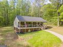 Charming single-story home featuring a spacious front porch, craftsman details, and a well-maintained lawn at 120 Trisha Ln, Grantville, GA 30220