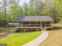 Charming single-story home featuring a spacious front porch, craftsman details, and a well-maintained lawn at 120 Trisha Ln, Grantville, GA 30220