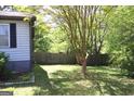 Fenced-in backyard with some landscaping and mature trees at 4793 Davenport Nw Trce, Acworth, GA 30101