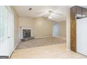 An open living room with carpeted flooring, fireplace, and glass doors to the outside at 110 Tamarack Trl, Mcdonough, GA 30252
