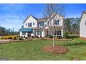 New home with a well-maintained lawn, tidy landscaping, and a pleasant neighborhood at 284 Villa Grande Dr, Locust Grove, GA 30248