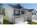 Well-maintained two-story home with a two-car garage and a manicured lawn at 12040 Conrad Cir, Hampton, GA 30228
