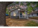 Cozy one-story home with a charming front porch, surrounded by mature trees at 3378 La Vista, Hapeville, GA 30354