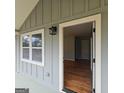 Inviting entryway with hardwood floors and a view into the home's interior at 487 Eastside Dr, Dacula, GA 30019