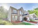 Two-story brick home with a manicured lawn and a two-car garage at 365 Othello Dr, Hampton, GA 30228
