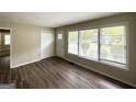 Bright living room with vinyl flooring featuring access to the front yard at 1994 Marvin Sw Ln, Atlanta, GA 30311
