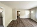 Bright living room with modern vinyl floors leading to kitchen and bedrooms at 1994 Marvin Sw Ln, Atlanta, GA 30311