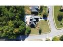 Aerial shot of home's spacious backyard and brick patio at 200 Kensington Trce, Stockbridge, GA 30281