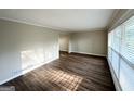 Inviting living room features hardwood floors, neutral paint, and window allowing natural light to fill the space at 2099 Yucca Dr, Decatur, GA 30032