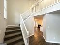 Carpeted staircase leading to the second floor with the view of the living room at 2578 Lavender Ct, Decatur, GA 30034
