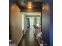 Hallway with dark hardwood floors leading to a view of the living room at 3168 Spicy Cedar Ln, Lithonia, GA 30038