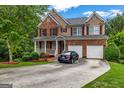 Beautiful two-story house with a two-car garage and a well-maintained front yard at 803 Baugh Springs Ln, Lawrenceville, GA 30044