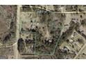 Aerial view shows property lines of land covered in trees at 2450 Highway 155 N, Mcdonough, GA 30252