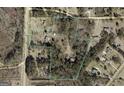 Aerial view of property and surrounding landscape with boundary lines highlighted at 2450 Highway 155 N, Mcdonough, GA 30252