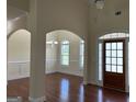 Open-concept foyer leading to the dining room and a wood-framed front door at 30 Scouts Ridge Dr, Covington, GA 30016