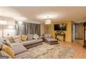 Comfortable living room featuring a large sectional, media setup, and ample space for relaxation and entertainment at 146 Highland Cir, Mcdonough, GA 30253