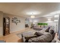 Spacious living room with a large sectional sofa, decorative rug, and stylish accents for a cozy feel at 146 Highland Cir, Mcdonough, GA 30253