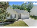 Charming single-Gathering home featuring manicured lawn, attached garage, and a welcoming facade at 462 Chase Marion Way, Mcdonough, GA 30253