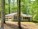 View of the home's garage and additional side entrance at 50 Ridgeview Dr, Jonesboro, GA 30236
