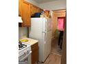 Practical kitchen with a refrigerator and an adjacent dining area, functional for everyday living at 3464 Kingswood Trl, Decatur, GA 30034