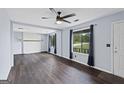 Inviting living room with brick fireplace and windows allowing natural light at 389 Rosser Rd, Mcdonough, GA 30252