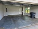 Empty two car garage with a window at 495 Mcgiboney Ln, Covington, GA 30016