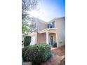 Inviting two-story home showcasing a cozy front porch and well-manicured shrubs at 386 Hill Crest Cir, Hiram, GA 30141