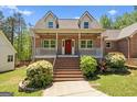 Inviting two-story brick home with a spacious front porch and landscaped front yard at 4014 Golfview Dr, Villa Rica, GA 30180