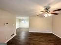 Spacious living room featuring sleek vinyl floors and a modern ceiling fan fixture at 2361 Collier Dr, Decatur, GA 30032