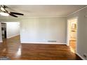 Inviting living room featuring gleaming hardwood floors and neutral paint at 2818 Lynda Pl, Decatur, GA 30032