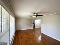 Bright living room with large windows and original hardwood floors at 2818 Lynda Pl, Decatur, GA 30032