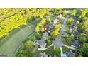 Beautiful aerial view of a home in a serene neighborhood, near a golf course at 110 Cadmium Ct, Peachtree City, GA 30269