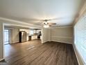 Inviting open-concept living area featuring hardwood floors, lots of natural light, and a clear view into the kitchen at 668 Fielding Sw Ln, Atlanta, GA 30311
