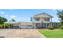 Charming home featuring a steel roof, ample parking, and a well-manicured lawn at 732 Sandhill Shady Grove Rd, Carrollton, GA 30116
