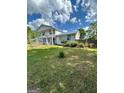 A cozy home featuring classic architecture and a spacious front yard at 732 Sandhill Shady Grove Rd, Carrollton, GA 30116
