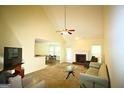 Inviting living room with a fireplace, comfortable seating, and access to the dining area at 25 Pacific Ave, Sharpsburg, GA 30277
