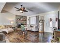 Inviting living room with stone fireplace and lots of natural light at 70 Grove Creek Dr, Locust Grove, GA 30248