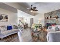 Spacious living room featuring wood floors, stone fireplace and comfortable seating at 70 Grove Creek Dr, Locust Grove, GA 30248