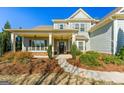 Inviting two-story home with covered porch and landscaped front yard, perfect for relaxing at 240 Sturry Dr # 71, Mcdonough, GA 30252