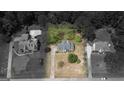 An aerial view captures the home's location within a neighborhood, showcasing the property's boundaries and landscaping at 250 Clearview Cir, Mcdonough, GA 30253